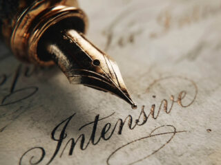 A person experiencing the benefits of writing by hand in a journal with a fountain pen.
